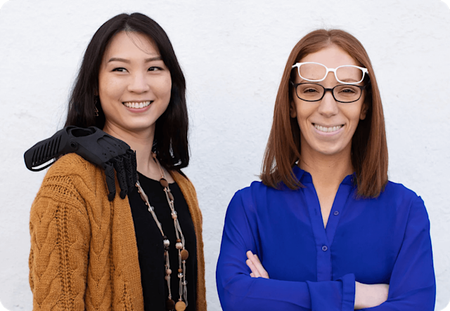 Image of two people standing and smiling. The visual demonstrates their experience with the Mailchimp’s integrations, and how users can learn from their case study.